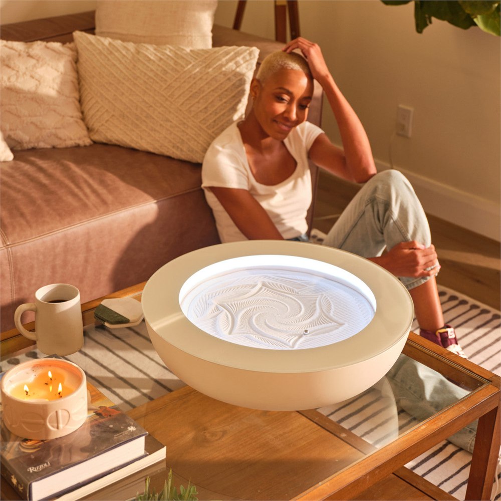 Cream HoMedics Drift on a living room coffee table