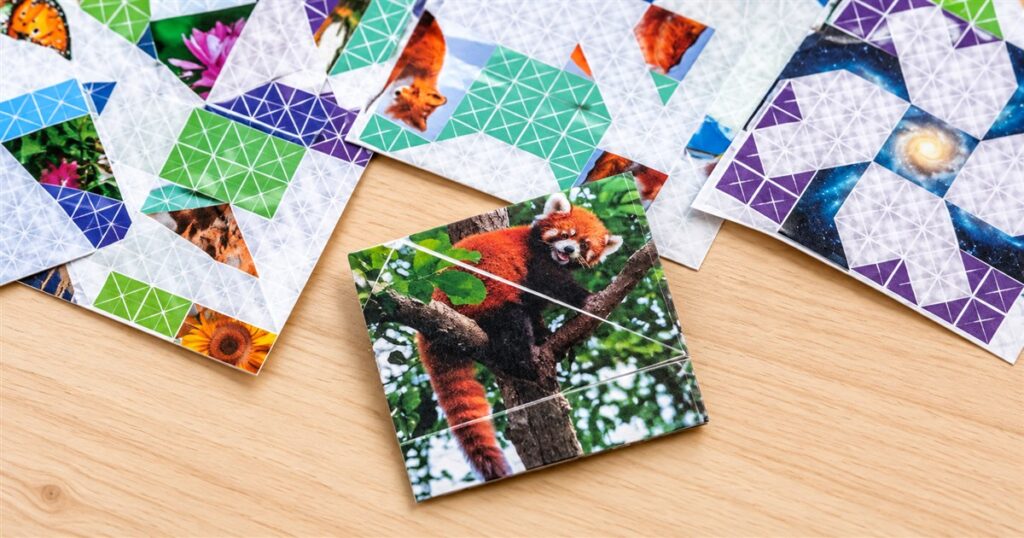 Folded red panda picture puzzle on a wooden desk