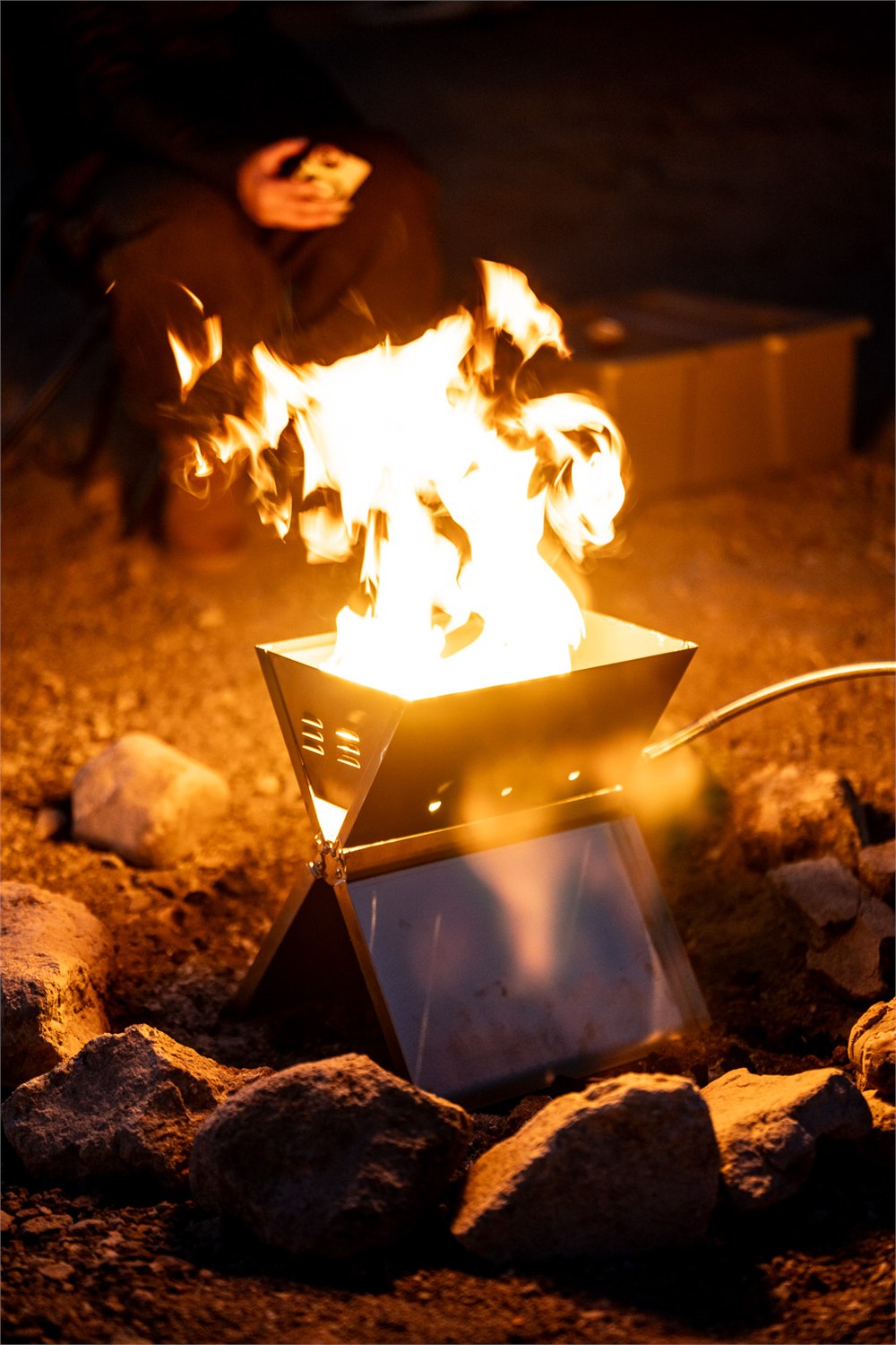 Rough Trails Equipment FireFold propane fire pit burning at camp