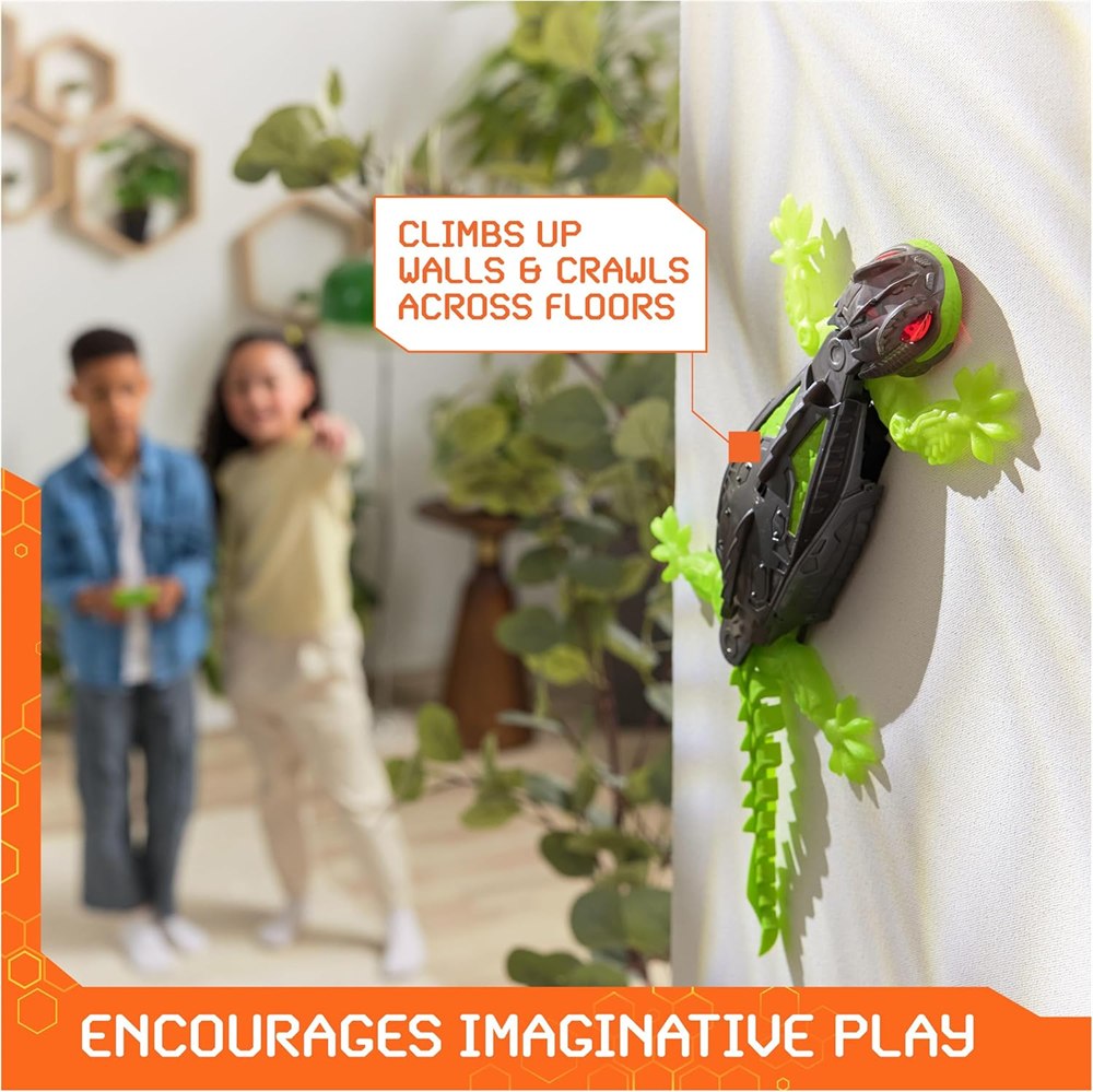 Black and green gecko toy climbing a wall during indoor play