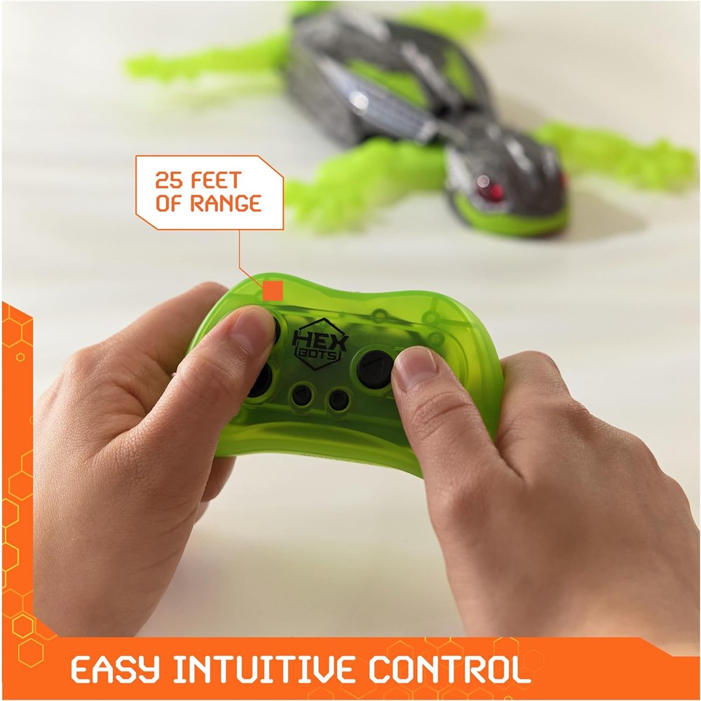 Hands using the green directional gecko remote control