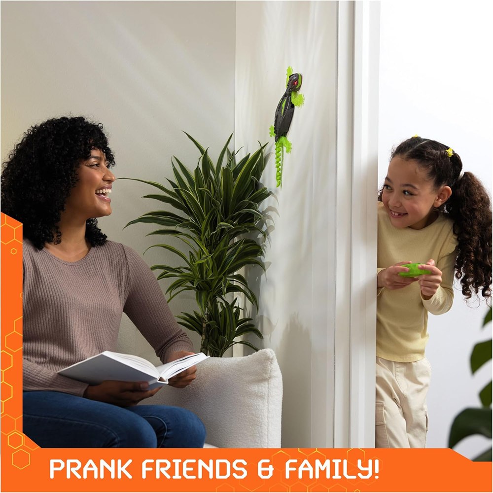 Child operating the gecko beside an adult reading