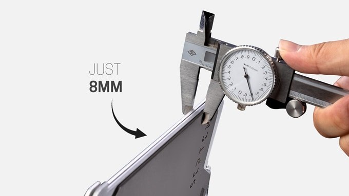 Caliper measuring the flat packed camp grill at 8 mm