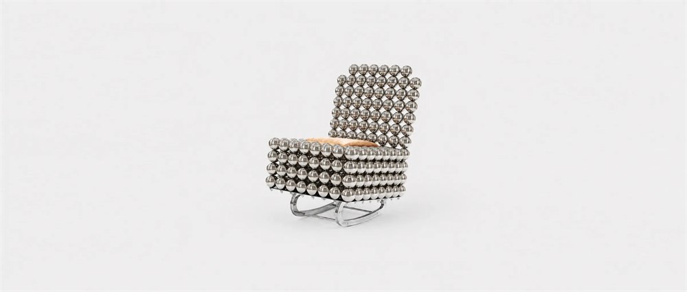 Wishes Collection rocking chair made from reflective steel spheres with a red cushion