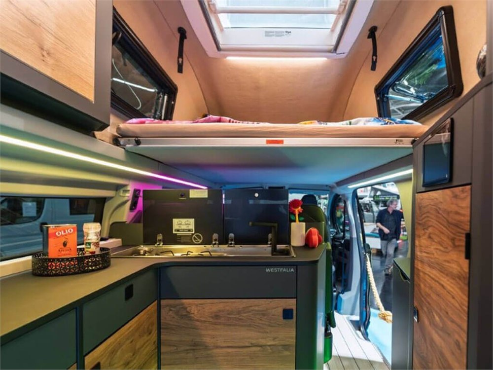 View from the kitchen toward the upper bed and cabin in the display vehicle
