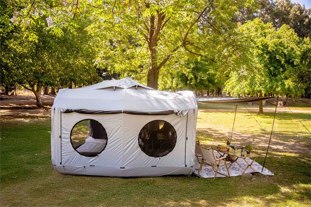 Rear side of the grey Cube tent with round windows