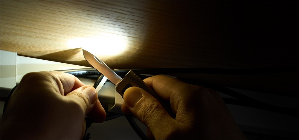 OKNIFE MK illuminating a cutting task under a shelf