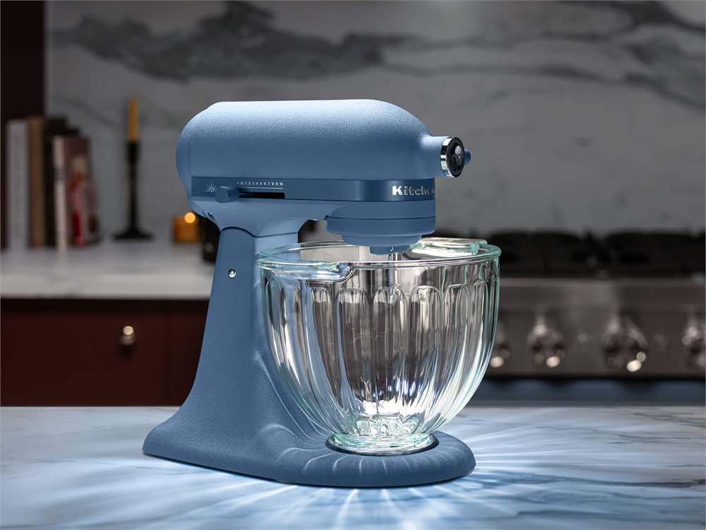KitchenAid Luminaire with its bowl light casting reflections onto a countertop