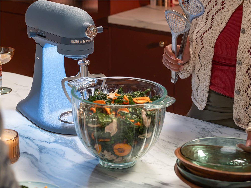 Luminaire beside its glass bowl filled with salad