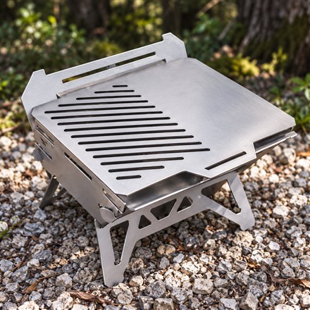 This Modular Titanium Camp Grill Packs Flat and Connects for Bigger Cookouts