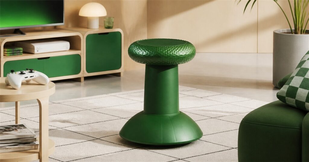 No-text editorial image of the green IKEA x Xbox YXSTABY thumbstick stool in a gaming living room