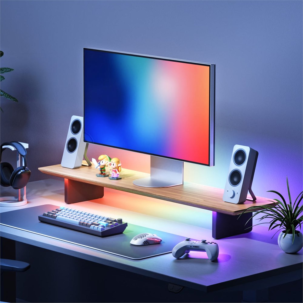 Monitor stand in a colorful gaming desk setup