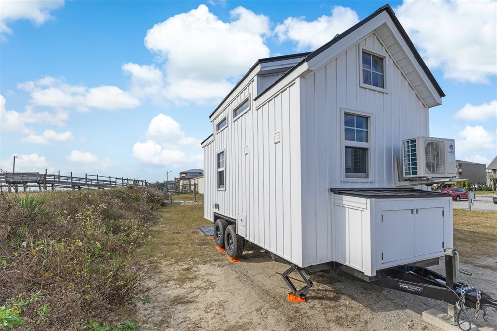 Exterior storage box and trailer details on the Petite Pelican tiny house