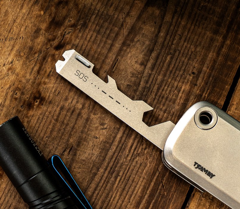 Close view of a sliding tool plate beside the silver housing