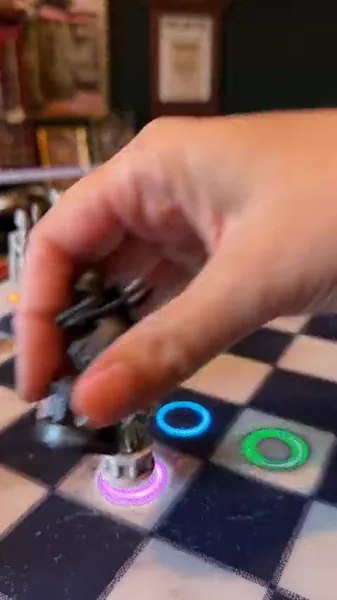 Colored coaching lights beneath pieces on the chessboard