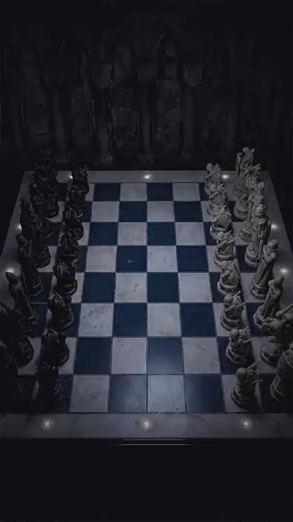 Overhead view of the physical wizard chessboard and opposing pieces