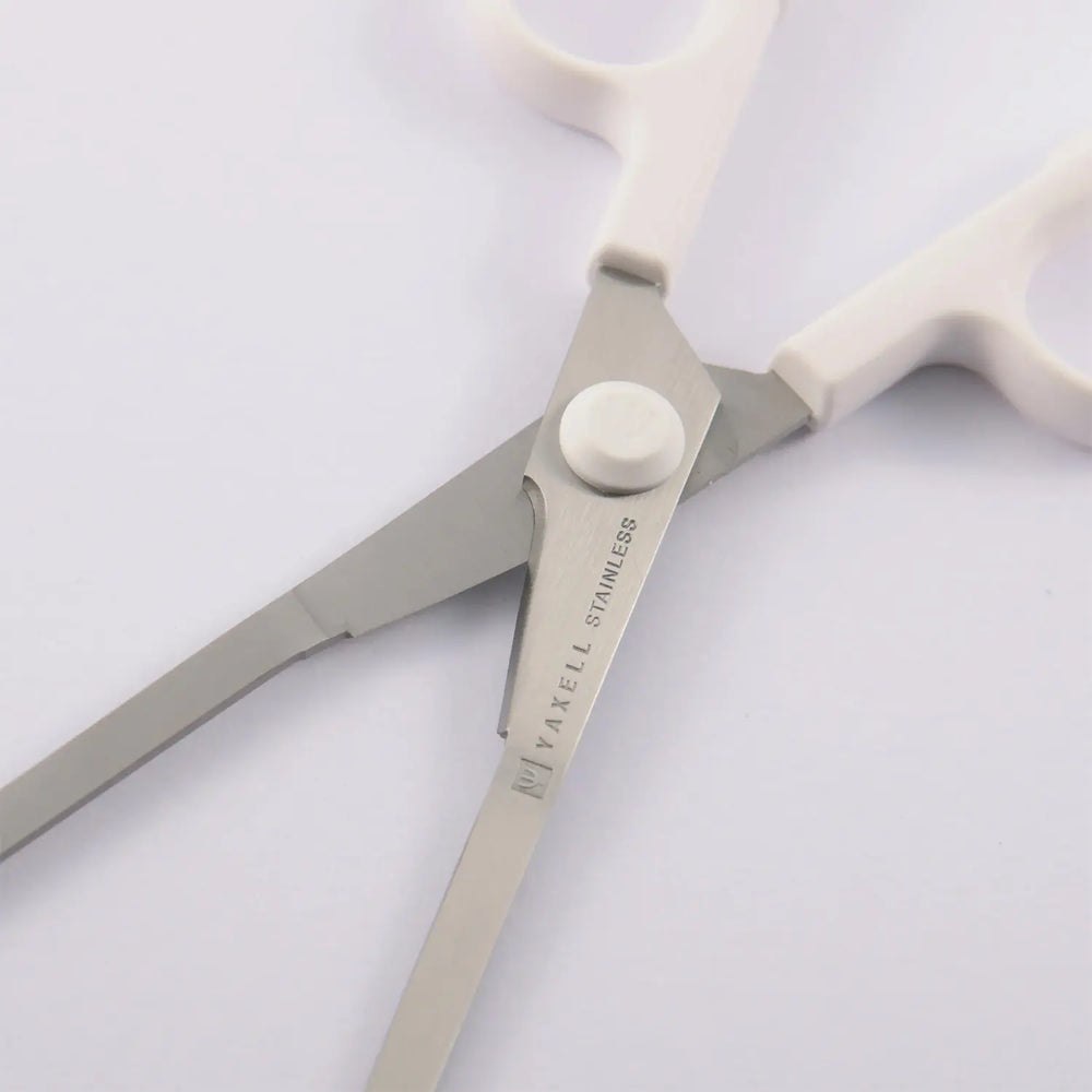 White handles and short cutting section near the scissors pivot