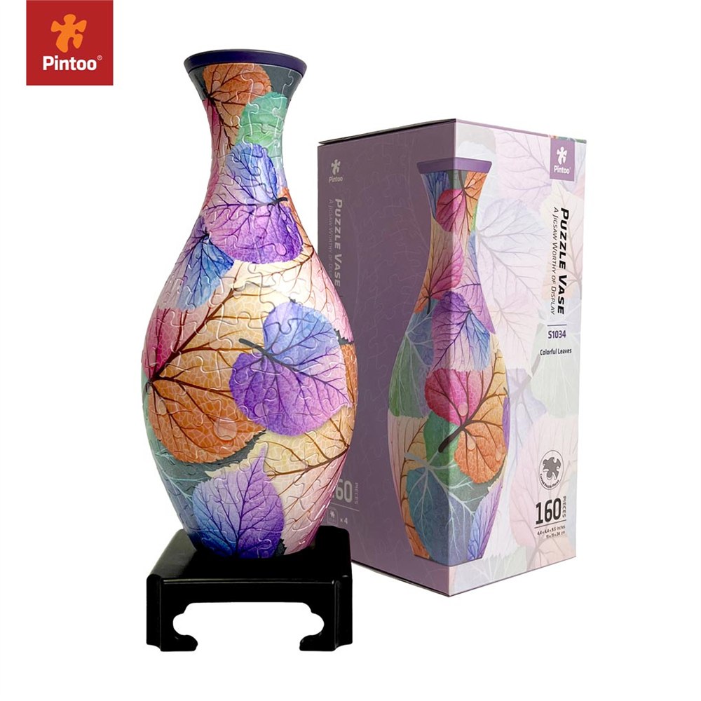 Colorful Leaves curved puzzle vase with its packaging and display stand
