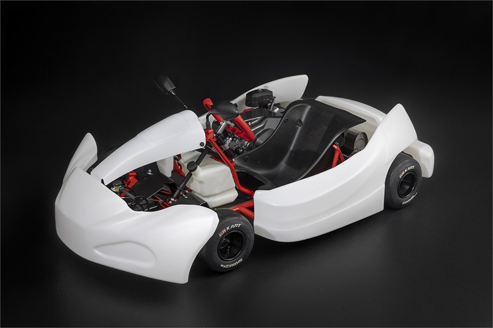 White Toyota GR KART with red frame and black single seat
