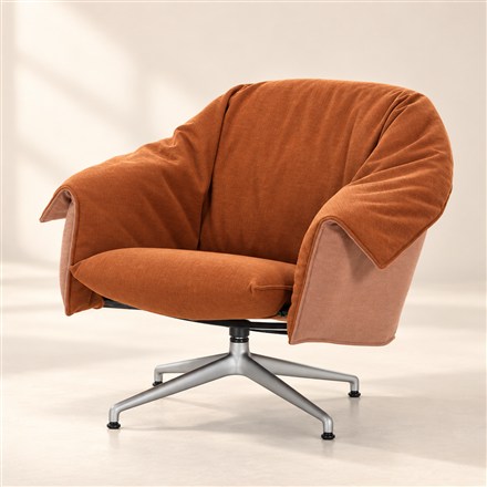 This Reclining Lounge Chair Moves With Your Body and Wears Its Fabric Like a Jacket
