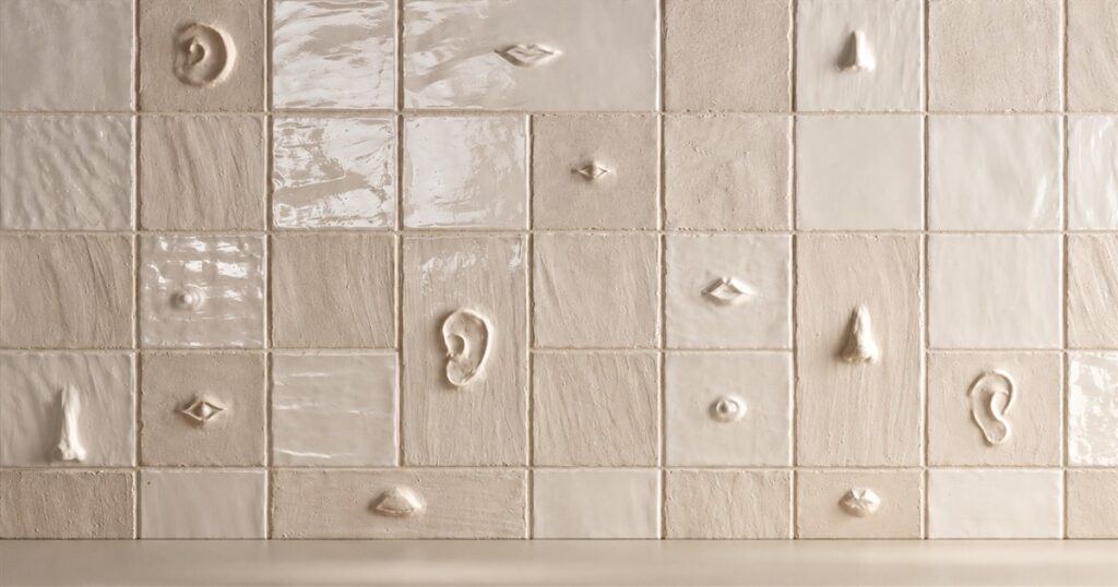 Chalk sculptural wall tiles with raised anatomical details