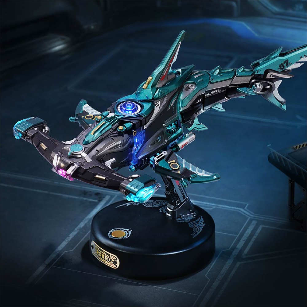 ROKR mechanical hammerhead shark model with teal armor on a black display base
