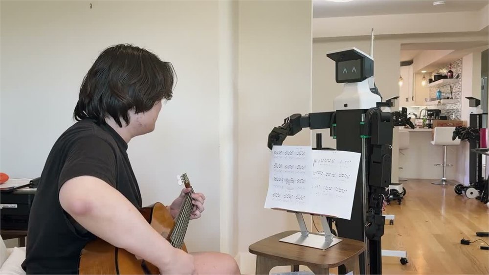 NORI robot beside a music stand during an official demonstration