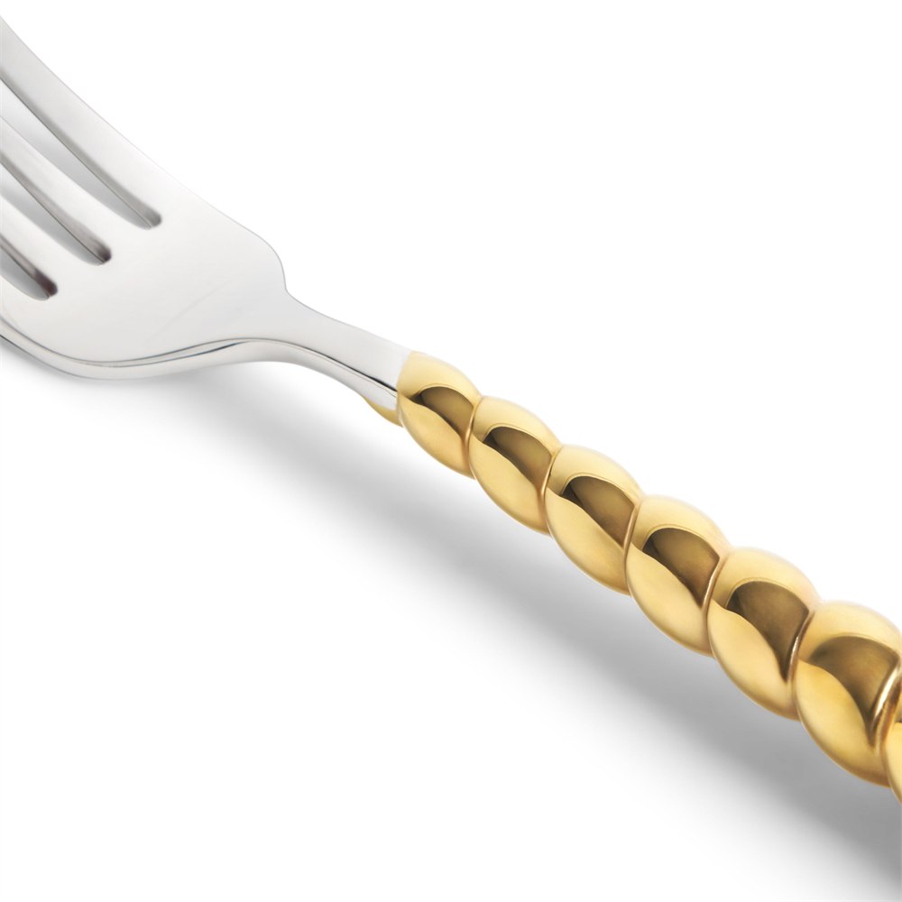 Dinner fork and sculpted gold shell handle detail