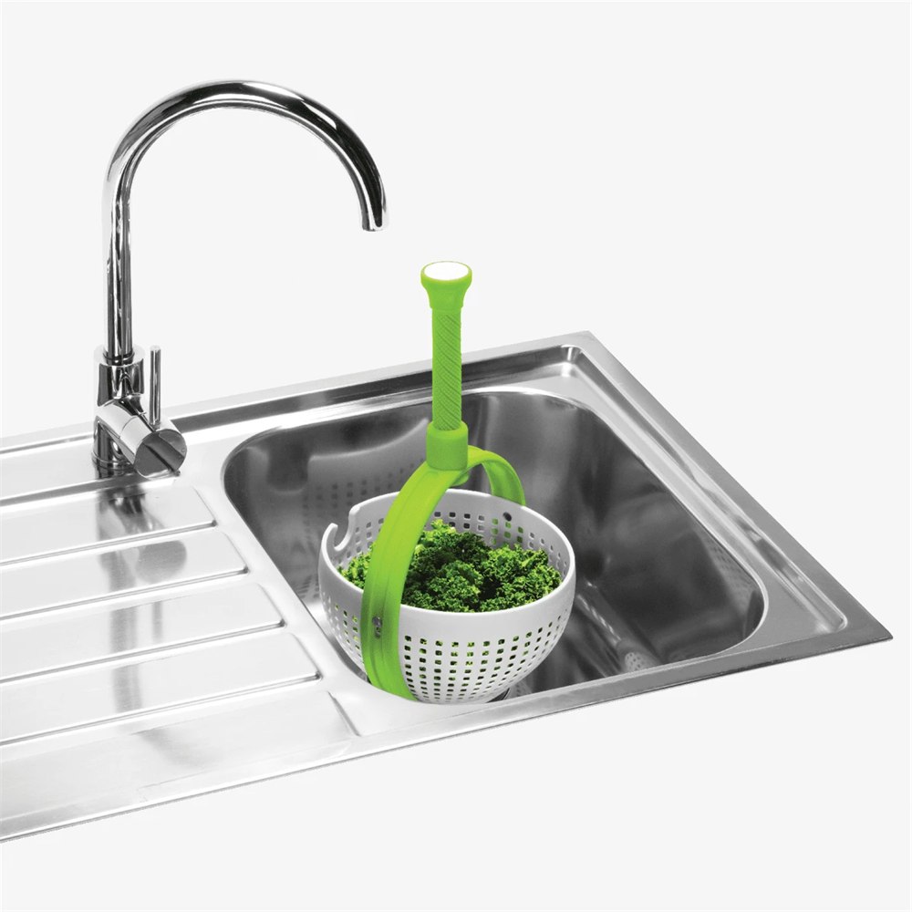 Spina in-sink salad spinner positioned beneath a faucet