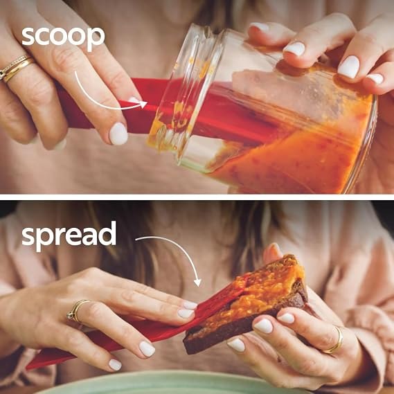 Red folding spoon scooping and spreading a soft ingredient