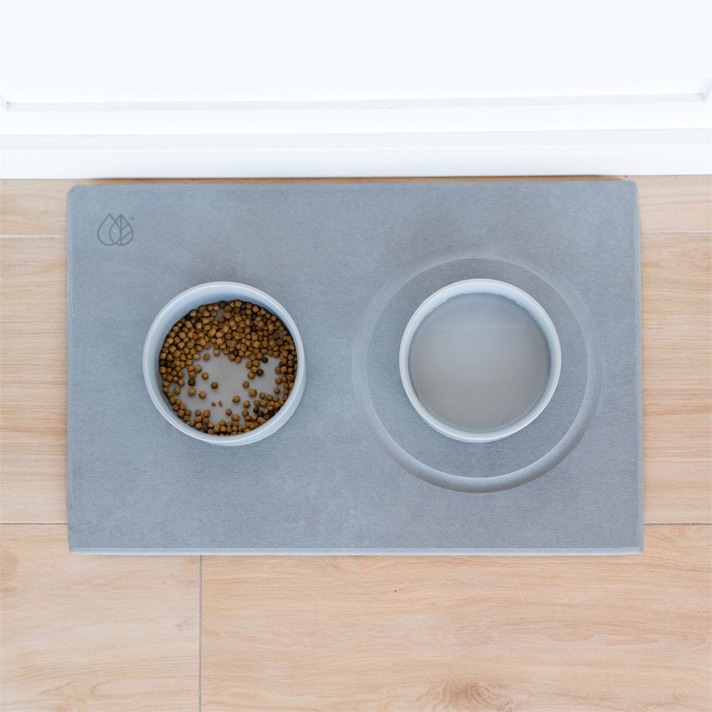 Food and water bowls in recessed positions on the stone base