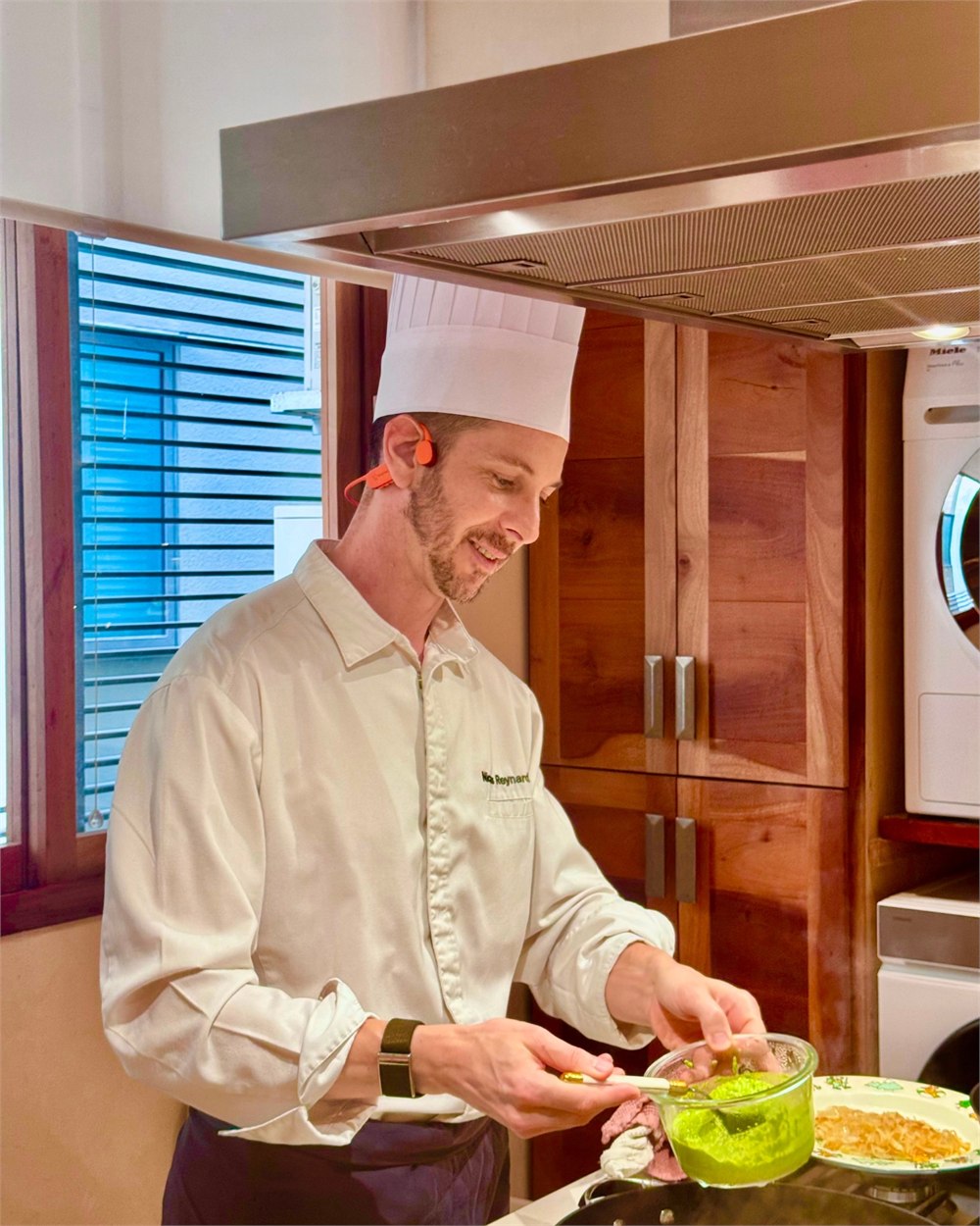 Chef using StudioChef KAI while preparing food in a kitchen
