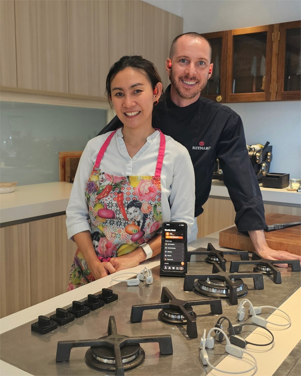 StudioChef KAI cooking demo with people at a kitchen counter