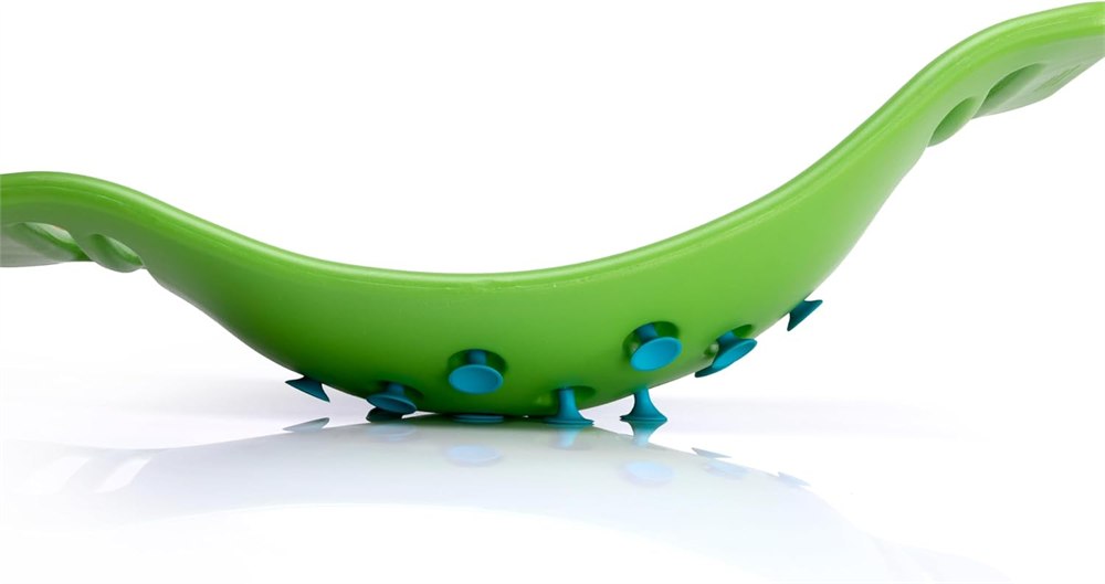 Underside suction cups contacting the floor on a green Teeter Popper