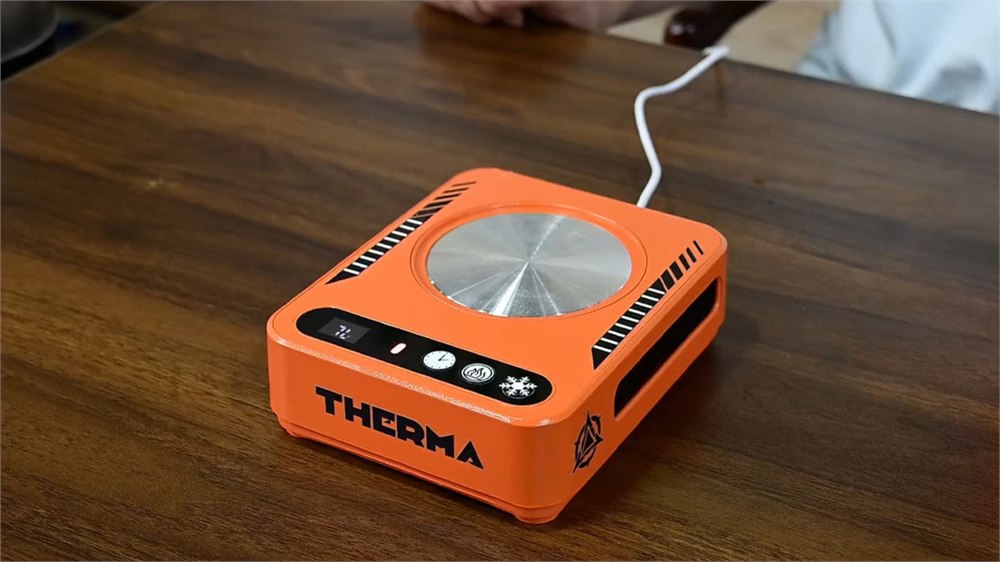 THERMA smart heating and cooling coaster on a wooden desk