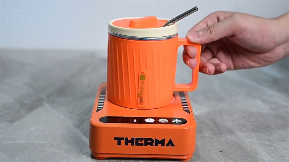 THERMA coaster with matching orange cup and lid