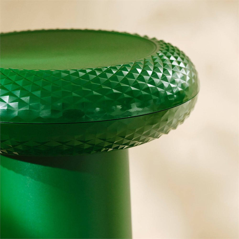 Close-up of the green textured seat on the IKEA YXSTABY thumbstick stool