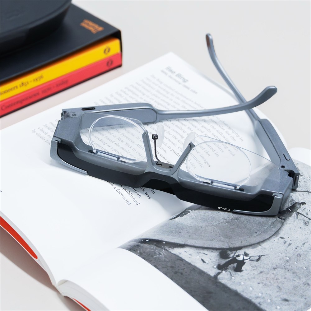 VIVIFoCAL S1 lens assembly and USB-C port resting on a book