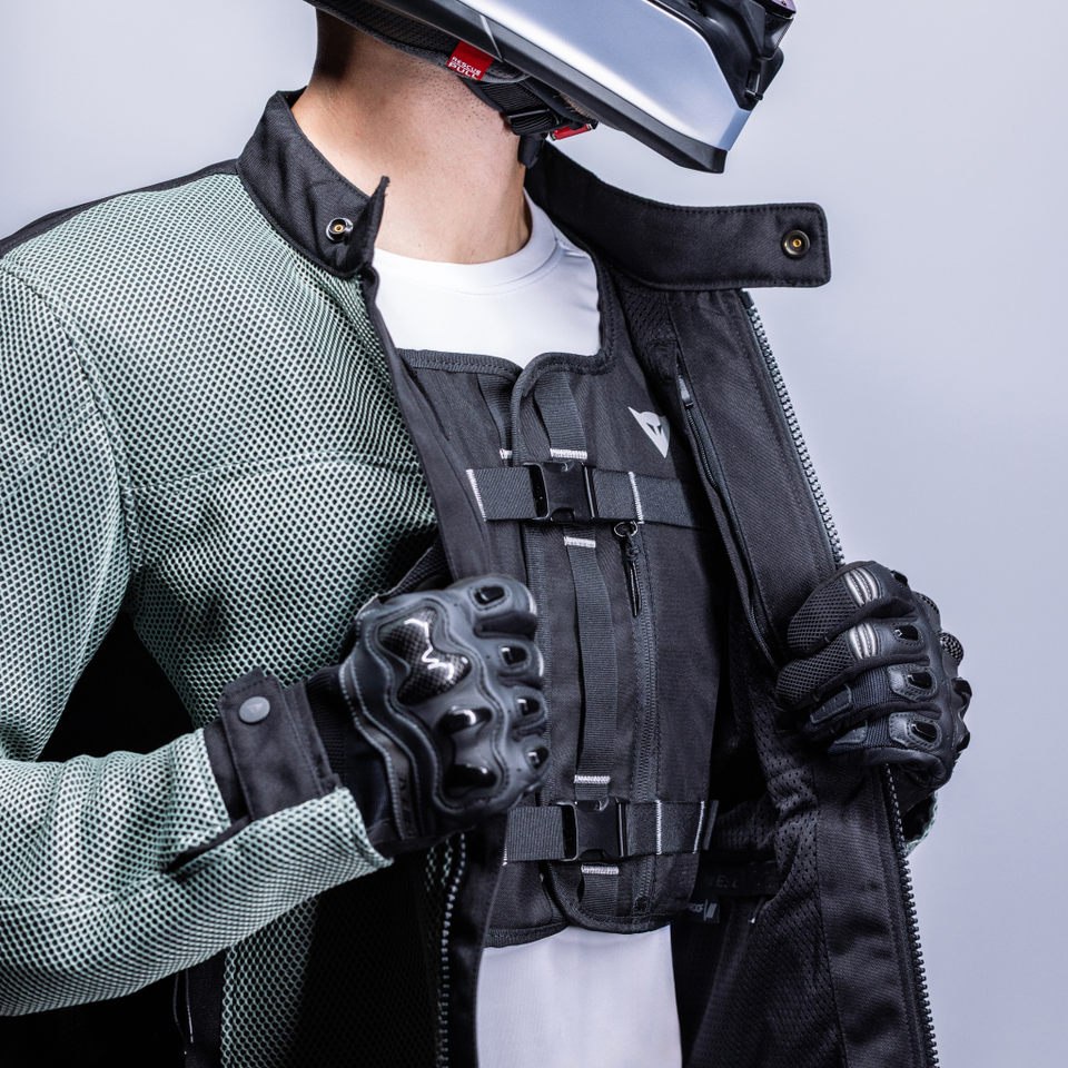 Smart GO airbag vest worn beneath an open motorcycle jacket