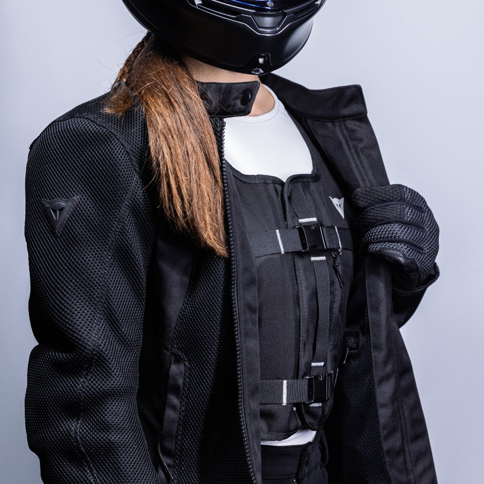 Second rider wearing Smart GO beneath a black riding jacket