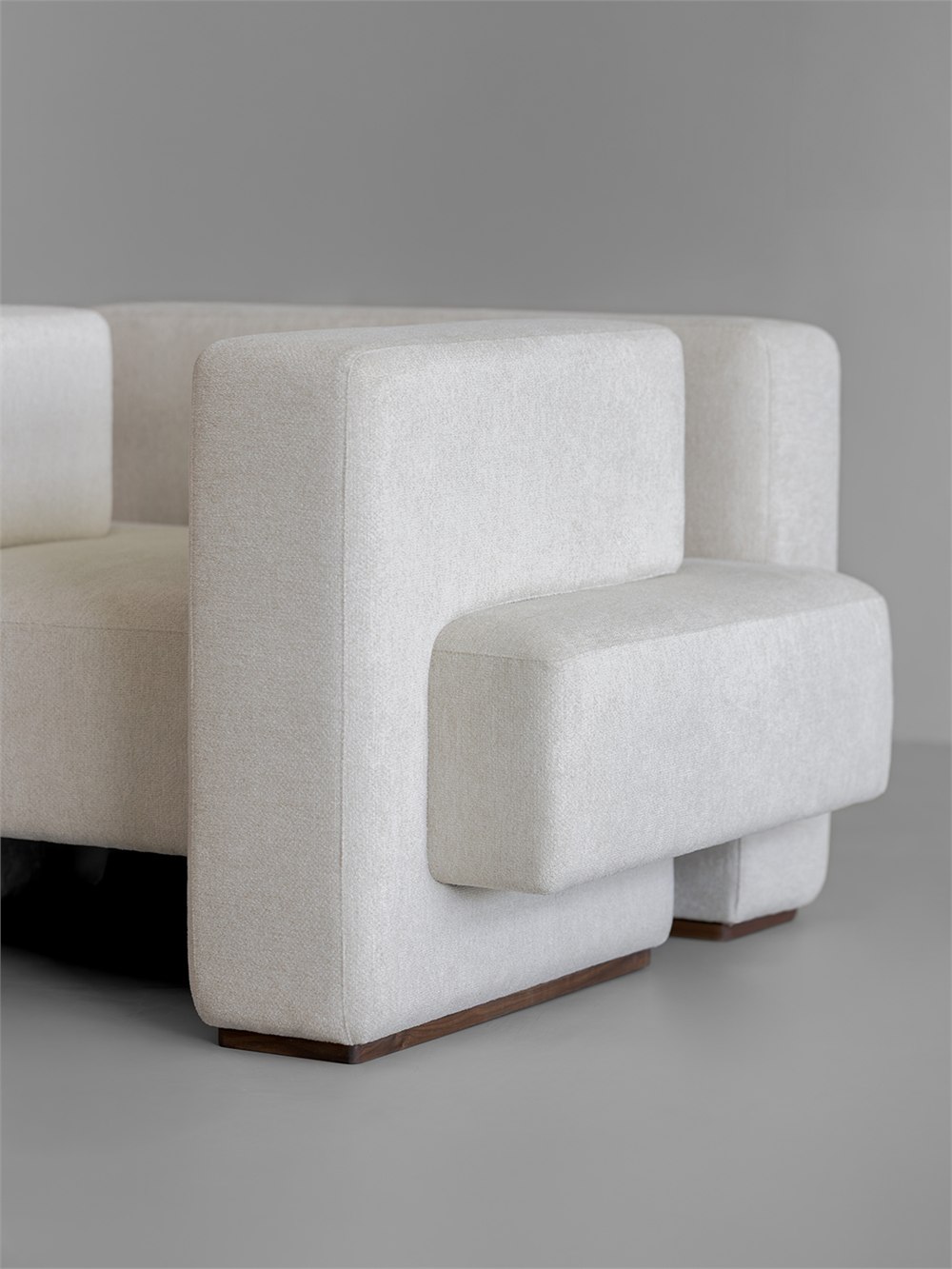 Intersecting seat and padded arm detail on the Gyeolgu sofa