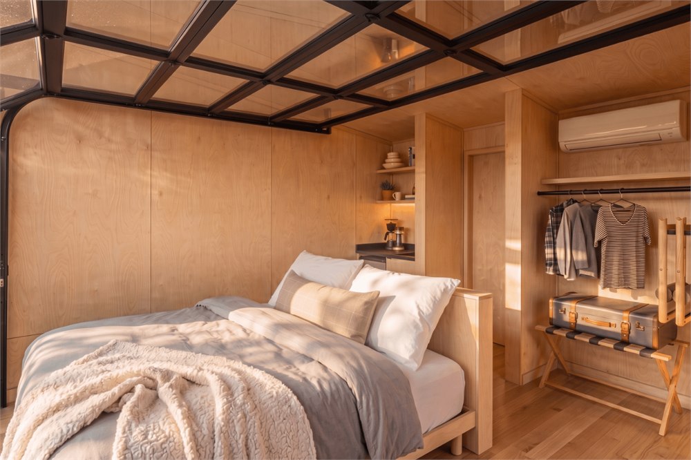 Atlas bedroom with open overhead garage door — manufacturer visualization