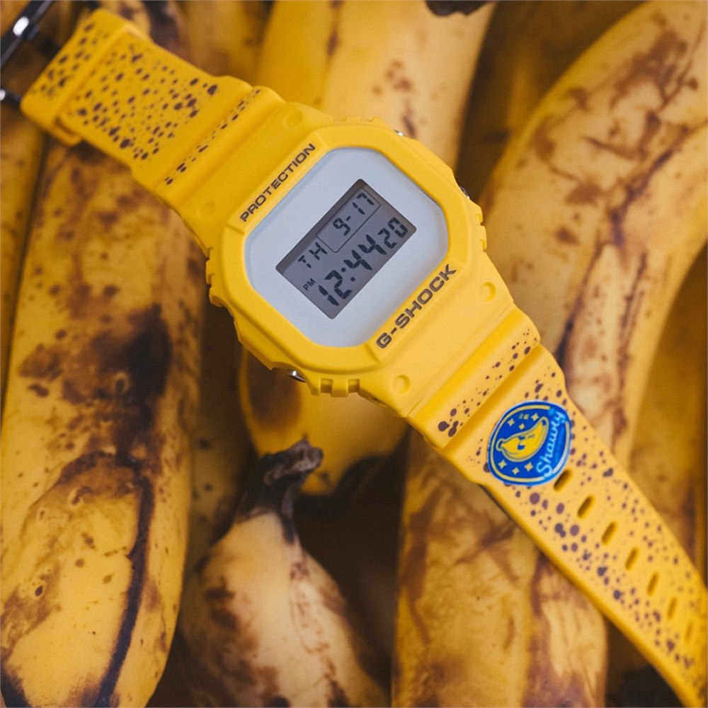 Freckled yellow watch photographed on ripe bananas