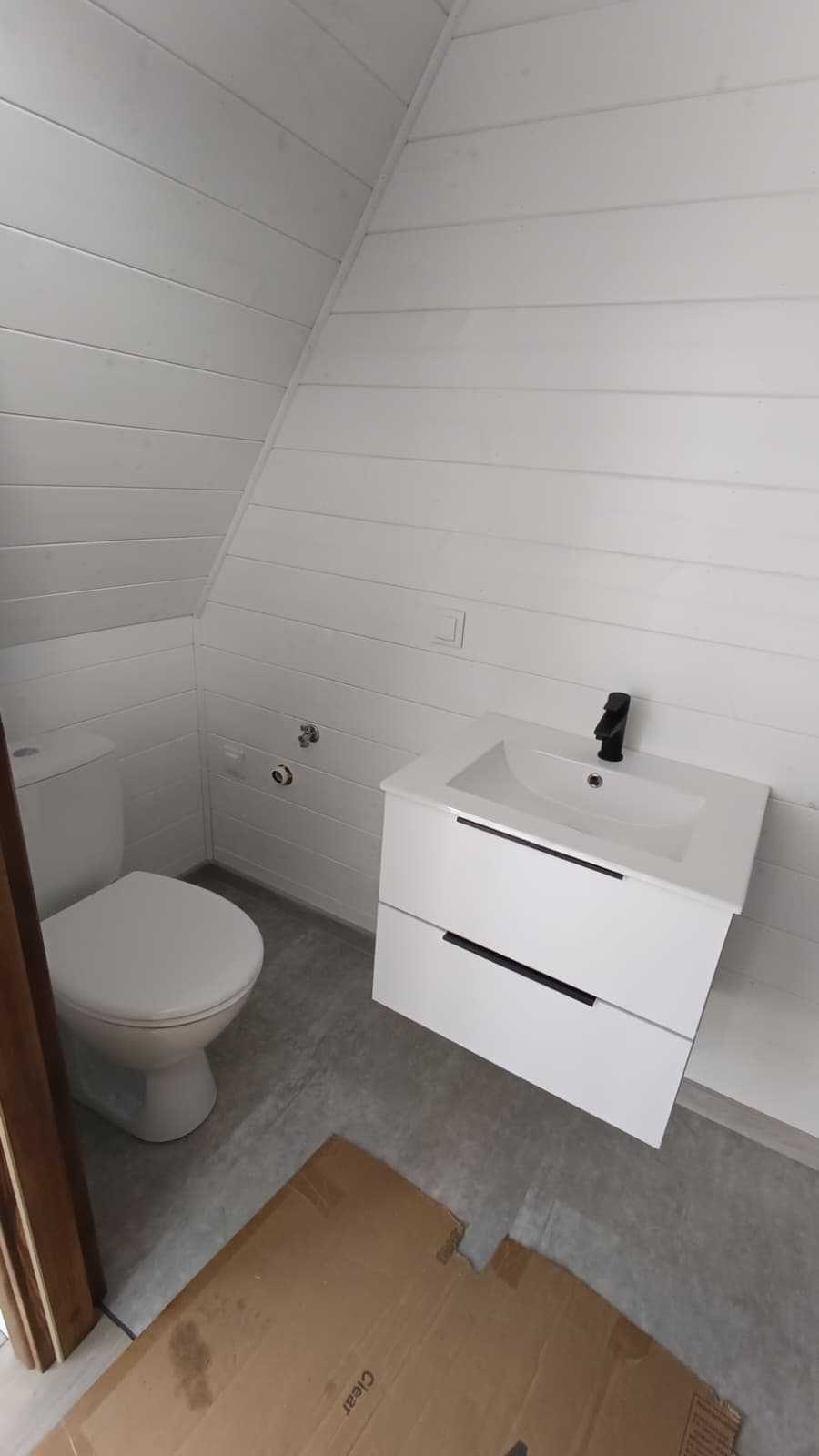 Compact bathroom vanity and toilet in the Mini Brda cabin