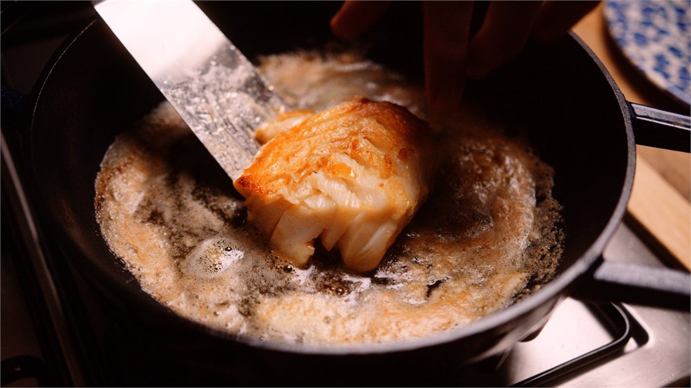Fish browning inside the FIREUP enameled braiser
