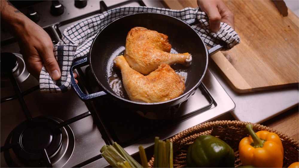 Chicken being browned in the FIREUP braiser