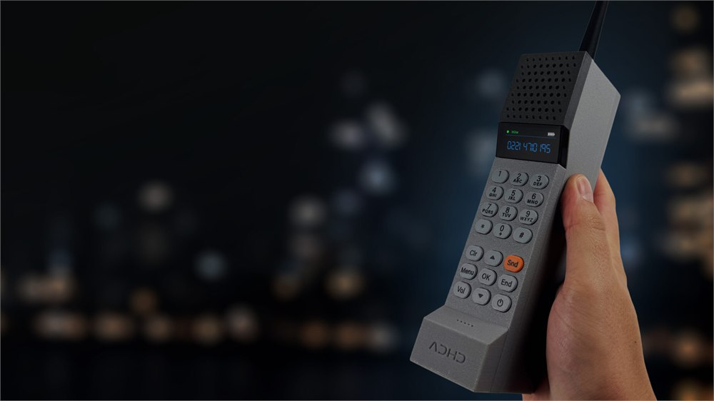 Gray retro brick handset held in one hand