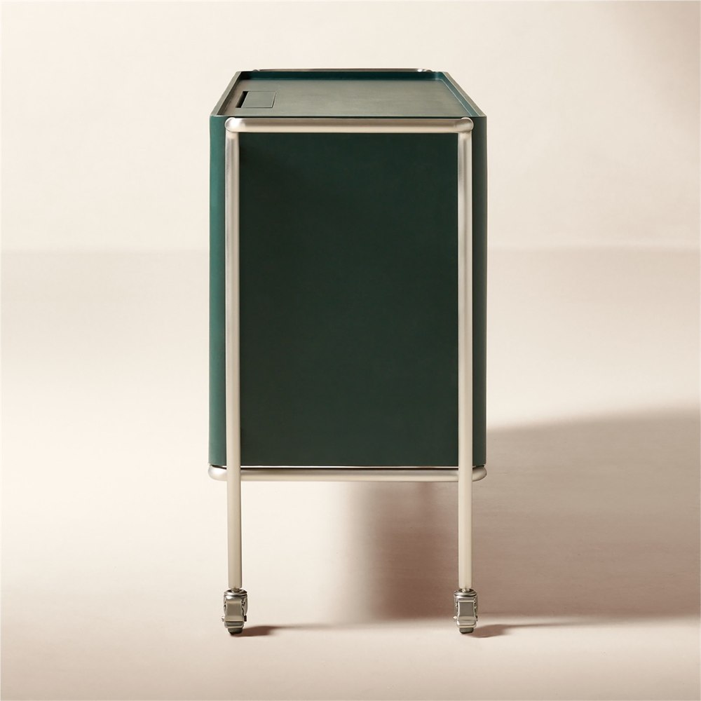 Side view showing green leather, a steel handle and caster wheels