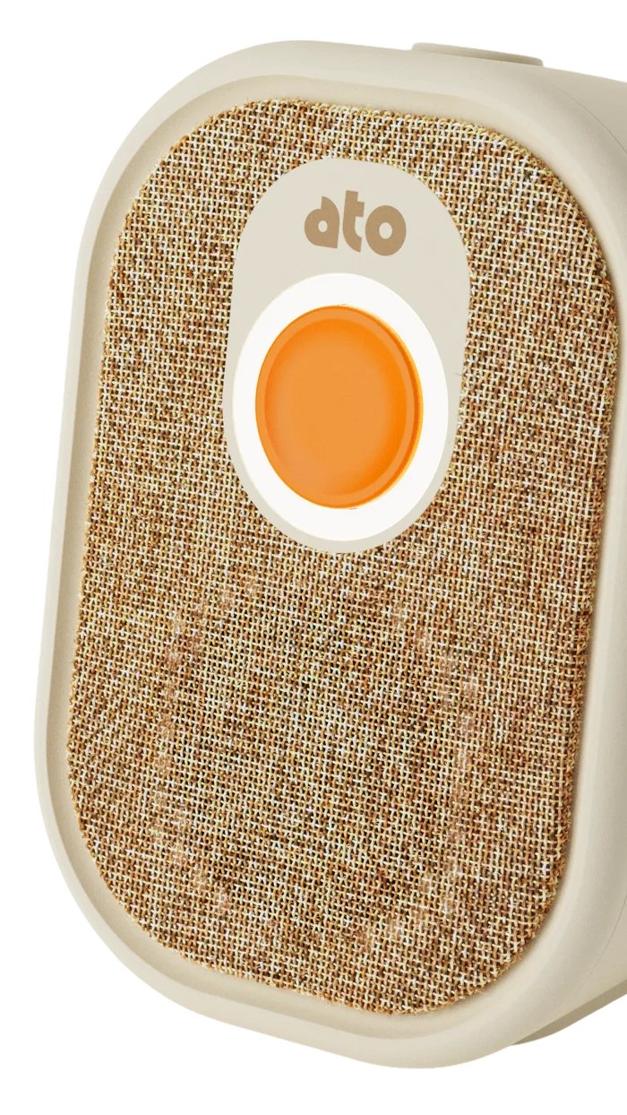 Close view of the orange action button and woven front