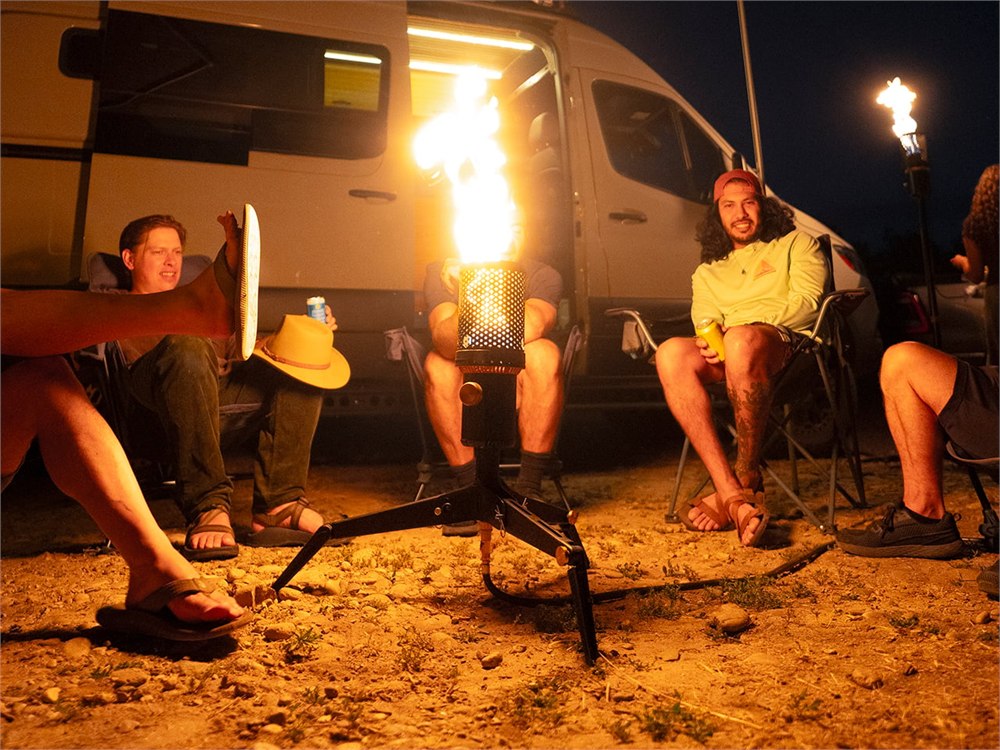 Camp Torch beside a camper van in low tripod configuration
